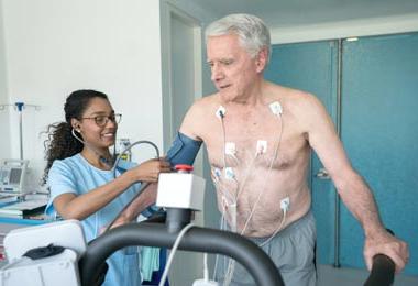 Older man getting heart tests done